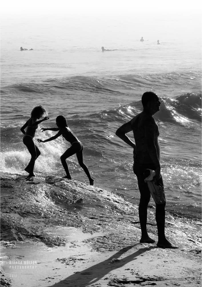 Girls Playing at Arpoador, Surfers in Background