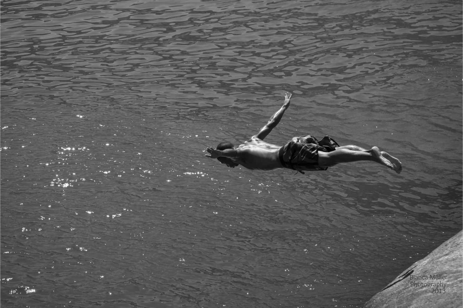 A Boy Jumping to Dive in Leme Waters